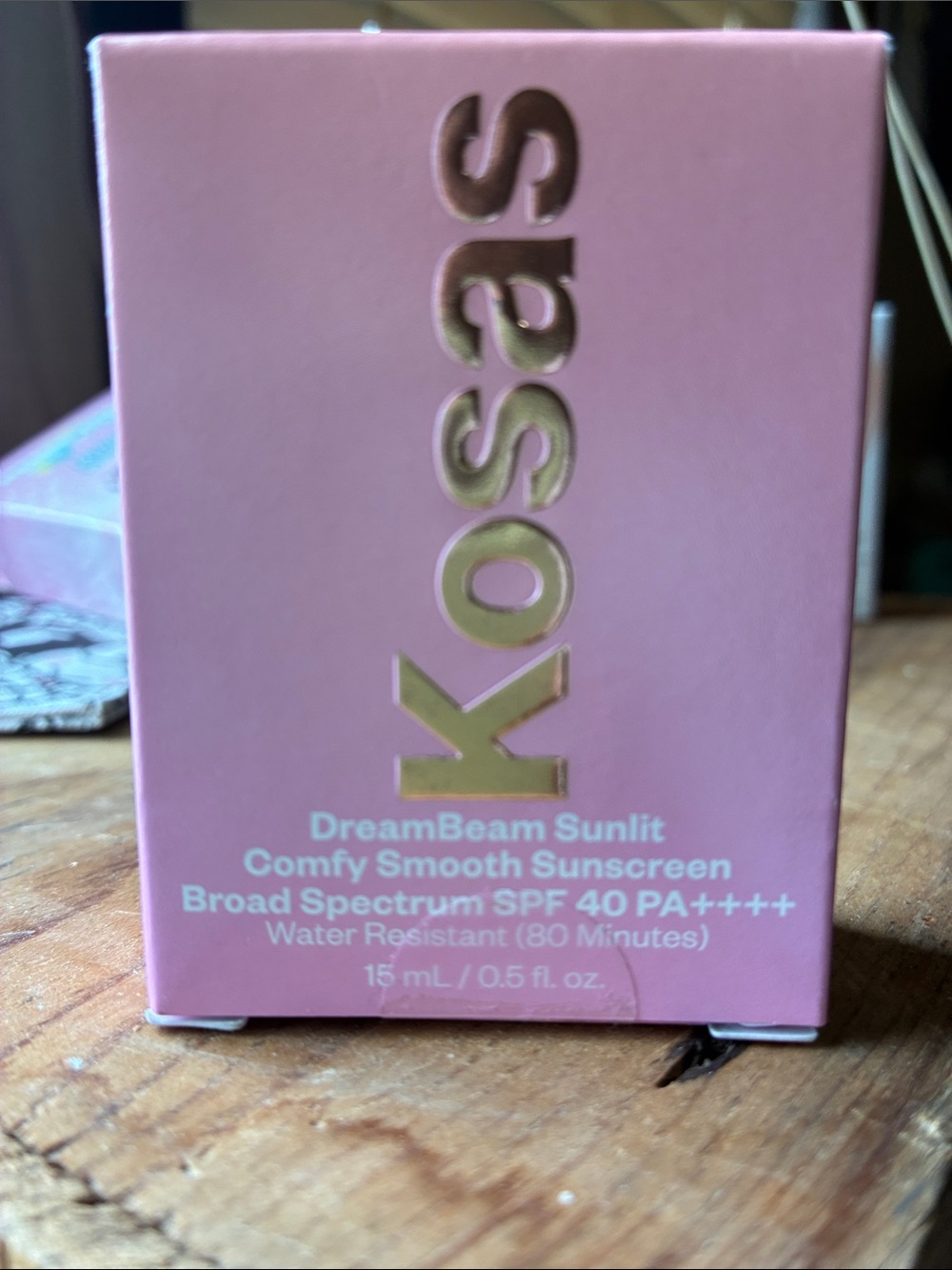 Kosas DreamBeam Sunlit Comfy Smooth Sunscreen - Pink with Gold Logo